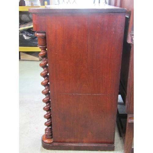 1859 - A Victorian mahogany bedroom chest with serpentine frieze enclosing a central over a flat fronted ch... 