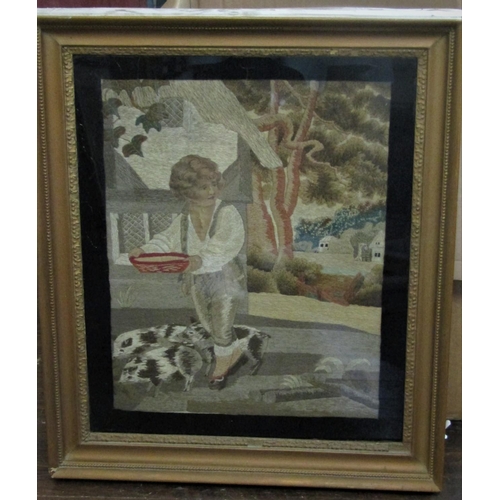 2235 - An early 19th century needlework picture of a boy feeding piglets, 42 x 33cm approx, in gilt frame