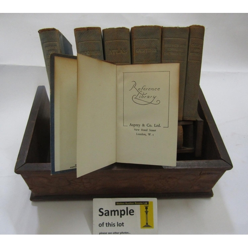 2355 - An Asprey & Co. Ltd reference Library, in a walnut book rest holding eight volumes, a collection of ... 