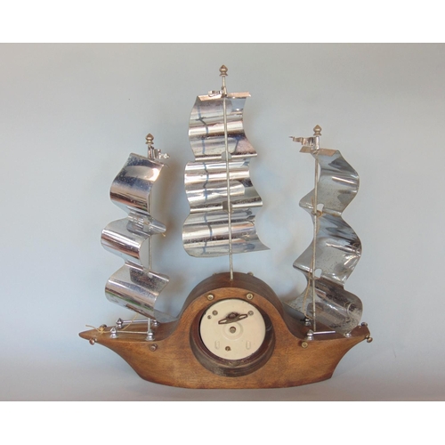 1186 - Novelty Smiths mantle clock in the form of a three mast ship with three shaped chrome sails, the con... 