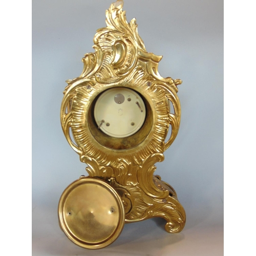 1193 - Rococo style gilt cast metal single train mantle clock, painted with Roman numerals, quartz movement... 