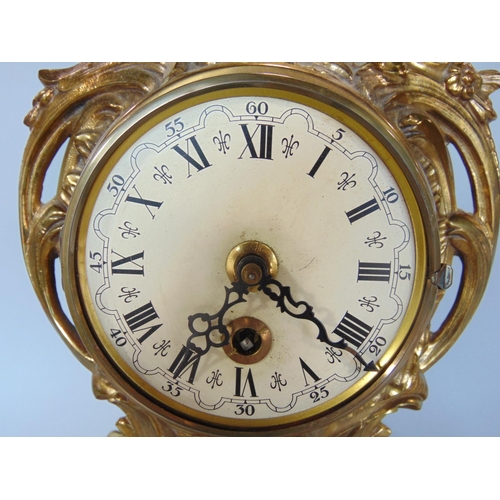 1193 - Rococo style gilt cast metal single train mantle clock, painted with Roman numerals, quartz movement... 