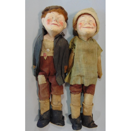 1244 - An unusual pair of early 20th century character  dolls  'Bisto Kids' with composition heads and stra... 