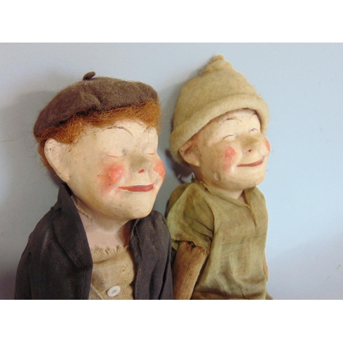 1244 - An unusual pair of early 20th century character  dolls  'Bisto Kids' with composition heads and stra... 