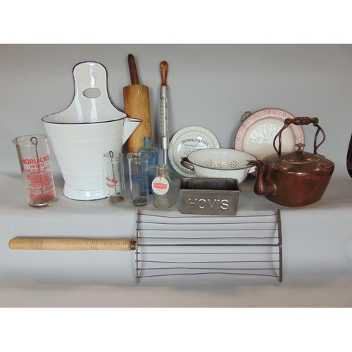 1406 - A mixed collection of antique kitchenalia to include various enamel wares, a copper kettle, three ho... 