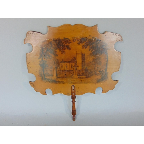 1421 - A Mauchline ware hand fan, the front decorated with a chapel scene with a carriage with a further bo... 