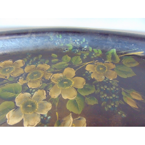 1436 - Large Victorian oval tray painted with various country flowers upon a black ground, 77 cm long (AF)