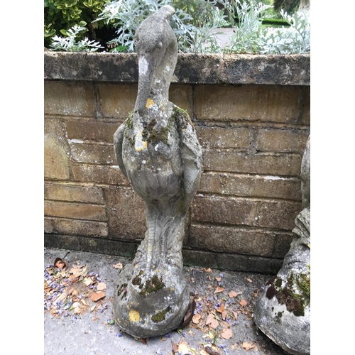 1680 - A pair of well weathered reconstituted herons in stalking pose (1 AF, but repairable) 90 cm high app... 