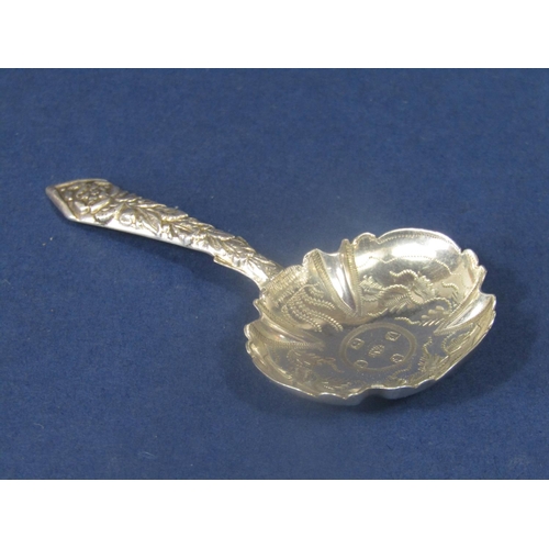 824 - William IV silver caddy spoon, the lobed bowl engraved with scrolled foliage with a cast handle, dec... 