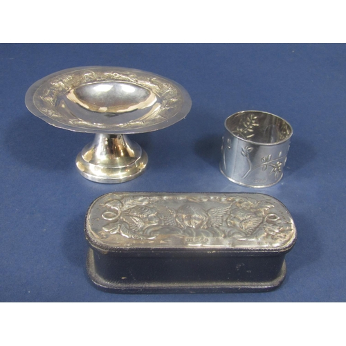 838 - A mixed collection of silver to include an eastern white metal tazza, the rim embossed with wildlife... 