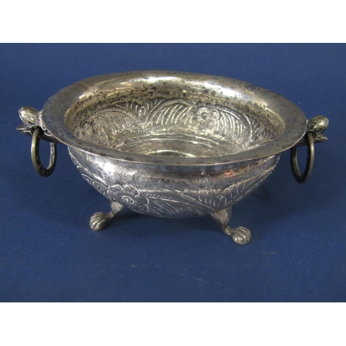 846 - Good antique probably Indian silver twin handled dish, the bowl embossed with various foliage, with ... 