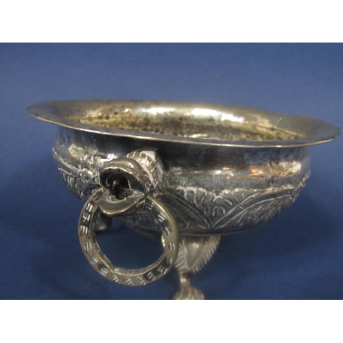 846 - Good antique probably Indian silver twin handled dish, the bowl embossed with various foliage, with ... 