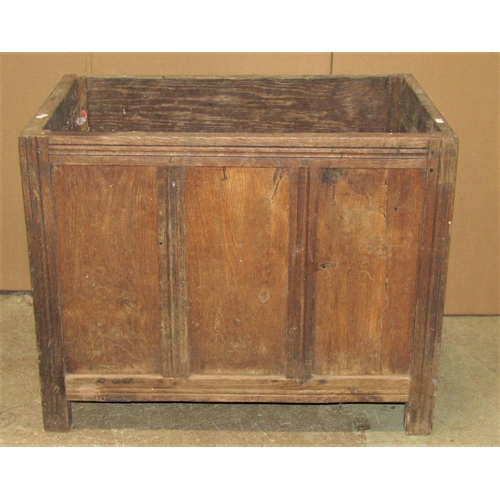 1788 - An Old English style low oak side cupboard partially enclosed by three fielded panelled doors over t... 