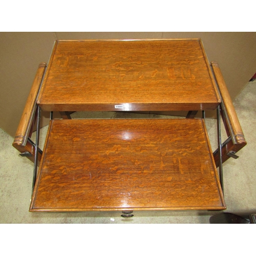 1880 - An early 20th century oak two tier metamorphic tea trolley raised on square cut supports and castors... 