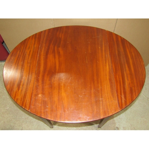 1899 - A small 19th century mahogany Pembroke table with oval drop leaves, with one real and one dummy frie... 