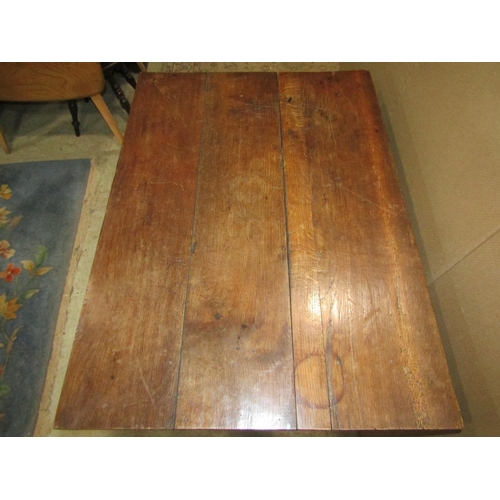 1923 - A Dutch style oak centre table, the rectangular plank top raised on four bulbous supports united by ... 