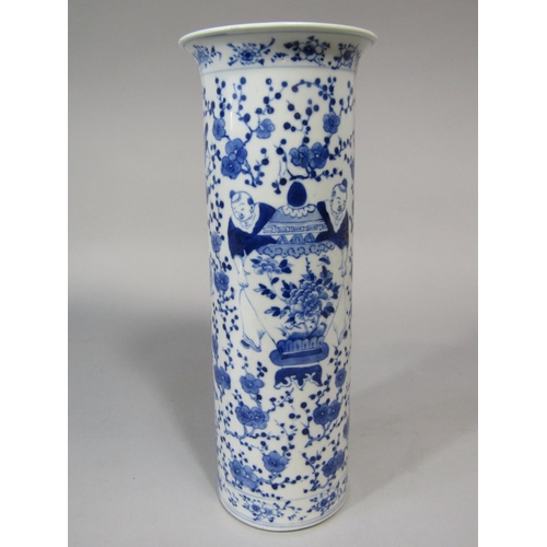 671 - A 19th century oriental vase of cylindrical form with blue and white painted decoration of figures h... 