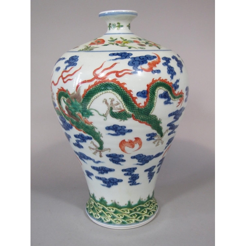 672 - An oriental vase of shouldered form with polychrome painted dragon, bat and cloud decoration, with b... 