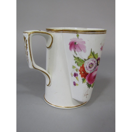 679 - An unusual early 19th century cream ware shaving mug with painted floral sprays, 11.5cm tall approx