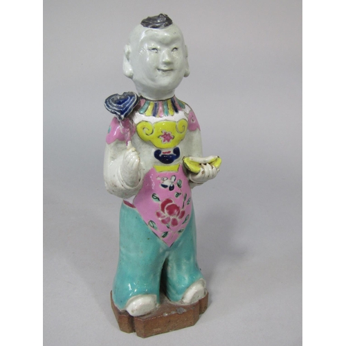 680 - An unusual oriental figure of a standing boy in polychrome painted suit (with restoration) 19.5cm ta... 