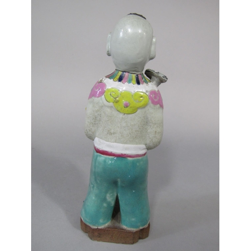 680 - An unusual oriental figure of a standing boy in polychrome painted suit (with restoration) 19.5cm ta... 