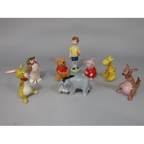 686 - A collection of eight Beswick Walt Disney figure from Winnie the Pooh series comprising Christopher ... 