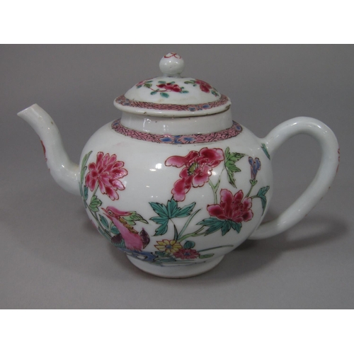 687 - An 18th century oriental tea pot and cover of globular form with famille rose painted bird and flora... 