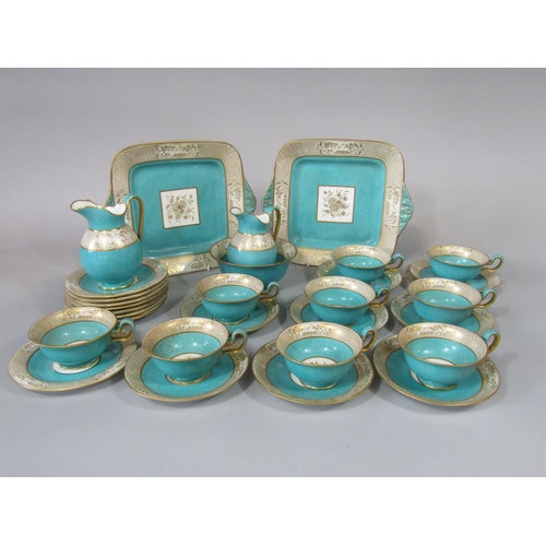 699 - A collection of Wedgwood tea wares with gilt border decoration in the chinoiserie manner with speckl... 