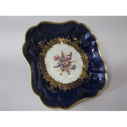 703 - A late 18th century Worcester blue ground dish of square shaped form with painted floral bouquet to ... 