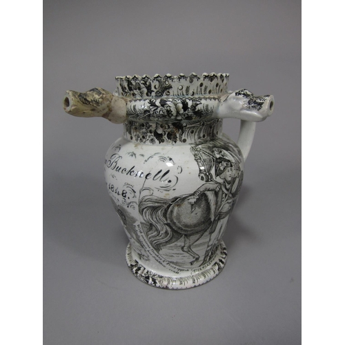 705 - An early 19th century puzzle jug with all over black printed decoration, subjects including The Sold... 