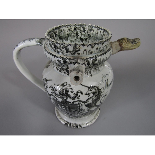 705 - An early 19th century puzzle jug with all over black printed decoration, subjects including The Sold... 