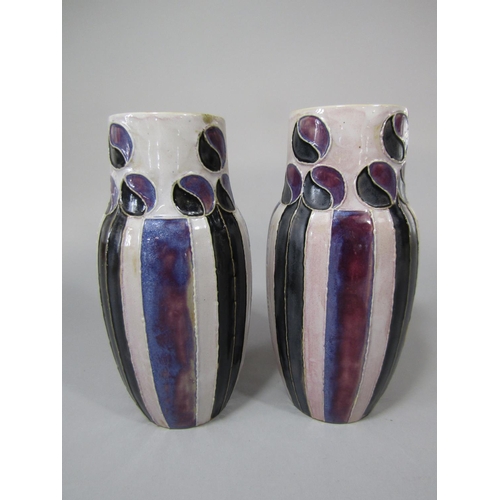 719 - A pair of unusual Royal Doulton vases with art nouveau style black and mottled purple decoration on ... 