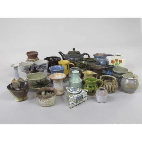 727 - A quantity of studio pottery wares of various design including a tea pot with slip decoration, vario... 