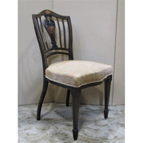 1932 - A pair of Edwardian occasional chairs with inlaid detail and shield shaped backs with pierced vase s... 