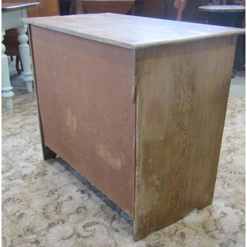 1943 - A small late Victorian stripped pine bedroom chest of three graduated drawers, with cast brass loop ... 