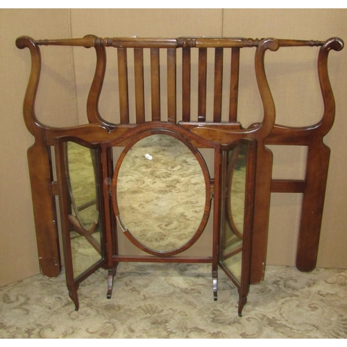 1955 - A Victorian walnut three divisional Canterbury with turned spindles, frieze drawer and further turne... 