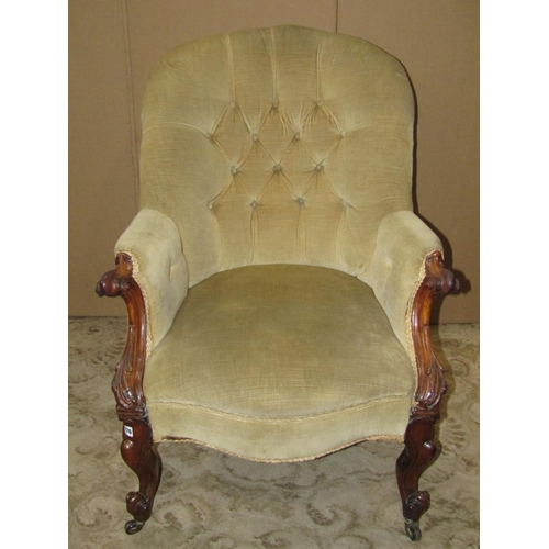 1976 - A Victorian spoon and button back drawing room chair, with partial rosewood show wood frame, scrolle... 