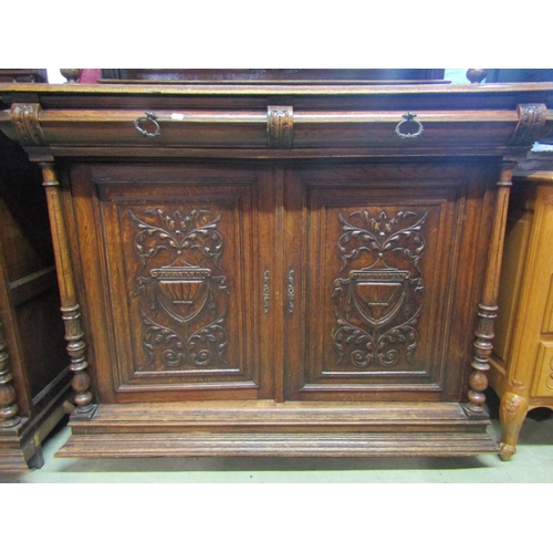 1987 - A pair of 19th century oak two sectional buffets, the upper enclosed by three panelled doors, two wi... 