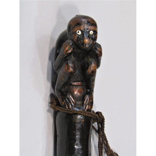 1263 - A primitive knobbly walking cane, possibly hawthorn, with carved monkey knop