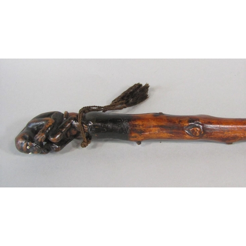 1263 - A primitive knobbly walking cane, possibly hawthorn, with carved monkey knop