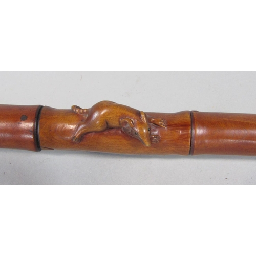 1264 - A good carved Japanese simulated bamboo fruit wood walking stick, mounted by a carved rat knop and s... 