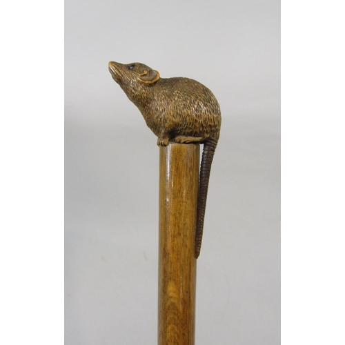 1265 - 19th century parasol, the handle carved with a rodent with glass eyes