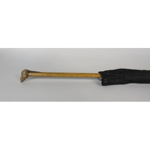 1265 - 19th century parasol, the handle carved with a rodent with glass eyes