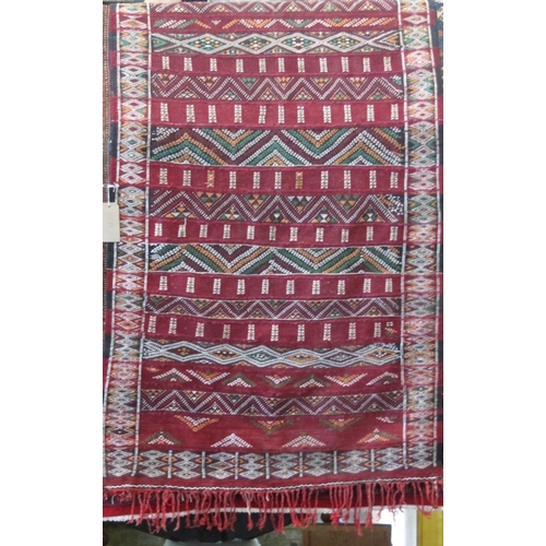 2377 - Tribal Kelim rug with various alternating geometric banded decoration upon a deep red and black grou... 