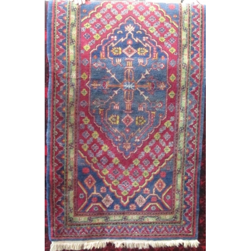 2380 - A good quality Persian full pile rug with central floral medallion and further floral bands upon a w... 