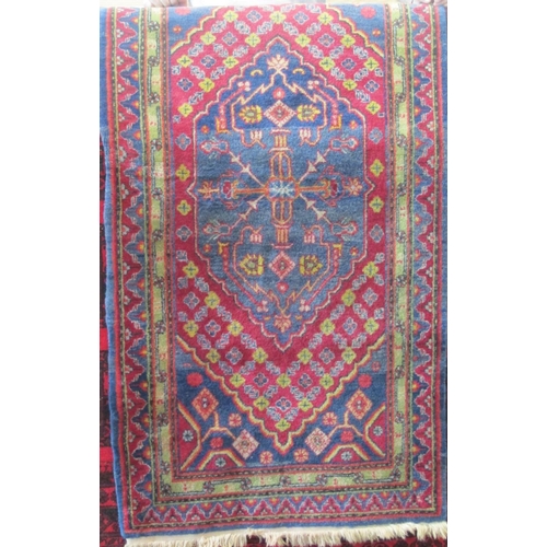 2380 - A good quality Persian full pile rug with central floral medallion and further floral bands upon a w... 