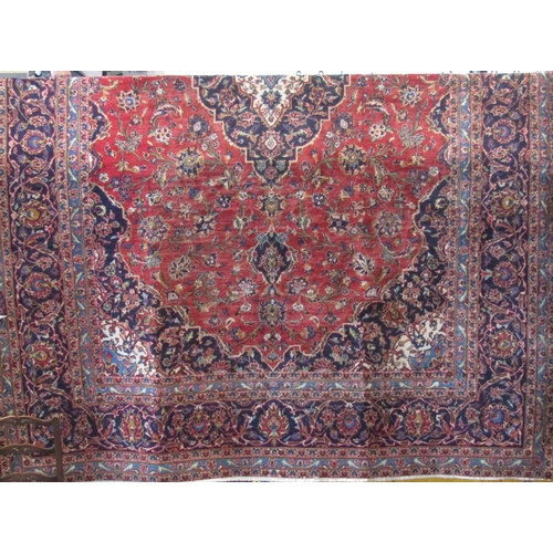 2382 - Good quality Hamadan type village Keshan carpet with scrolled floral decoration upon a red ground, 3... 