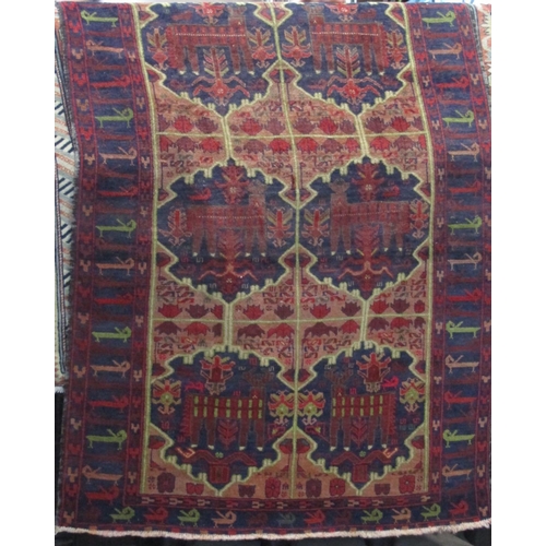 2394 - Good quality old Baluchi rug with still life icon decoration upon a navy blue ground, 190 x 150cm