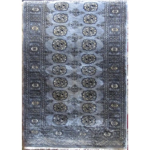 2409 - Full pile Bokhara rug with geometric repeating medallion decoration upon a light blue ground, 160 x ... 