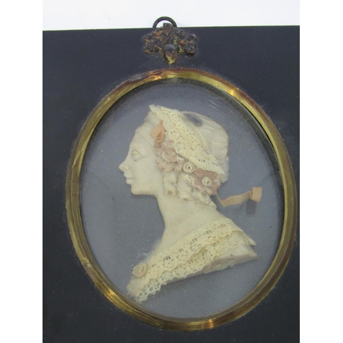 1109 - LESLIE RAY (Early 20th century British) , a pair of bust length miniature portraits of a lady and ge... 